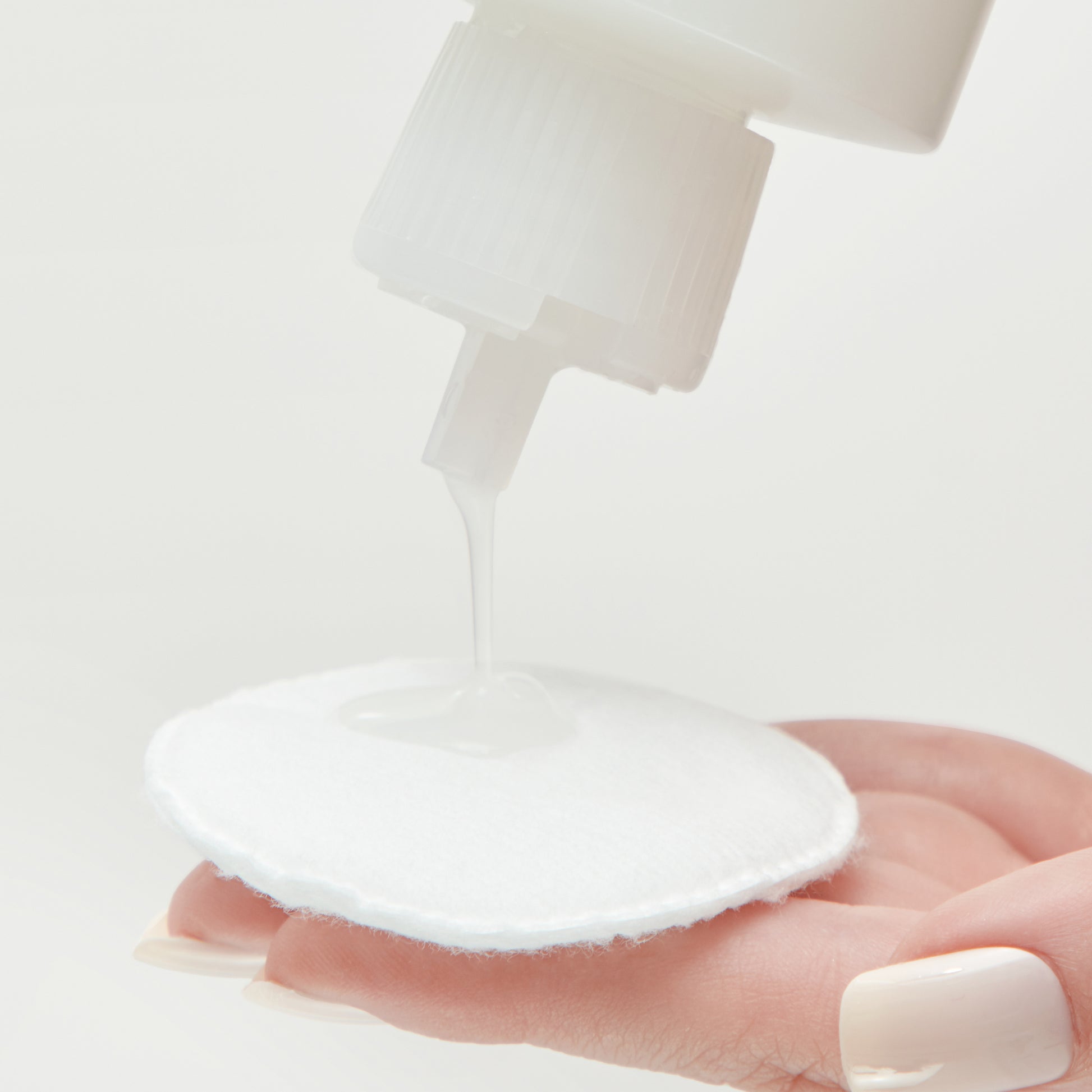 Demonstration showing how to use Hydrating Glow Toner on a cotton pad