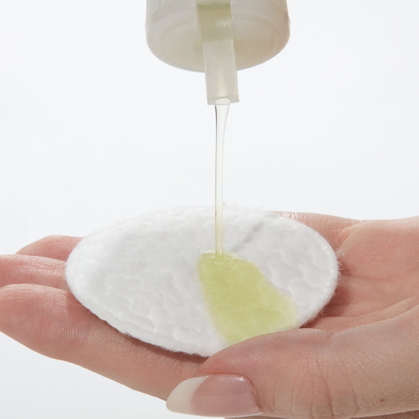 Demonstration showing Special C Toning Lotion on a cotton pad