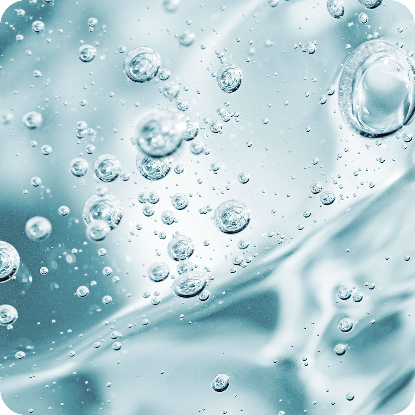 Close-up of water droplets on a textured surface with a blue tint.