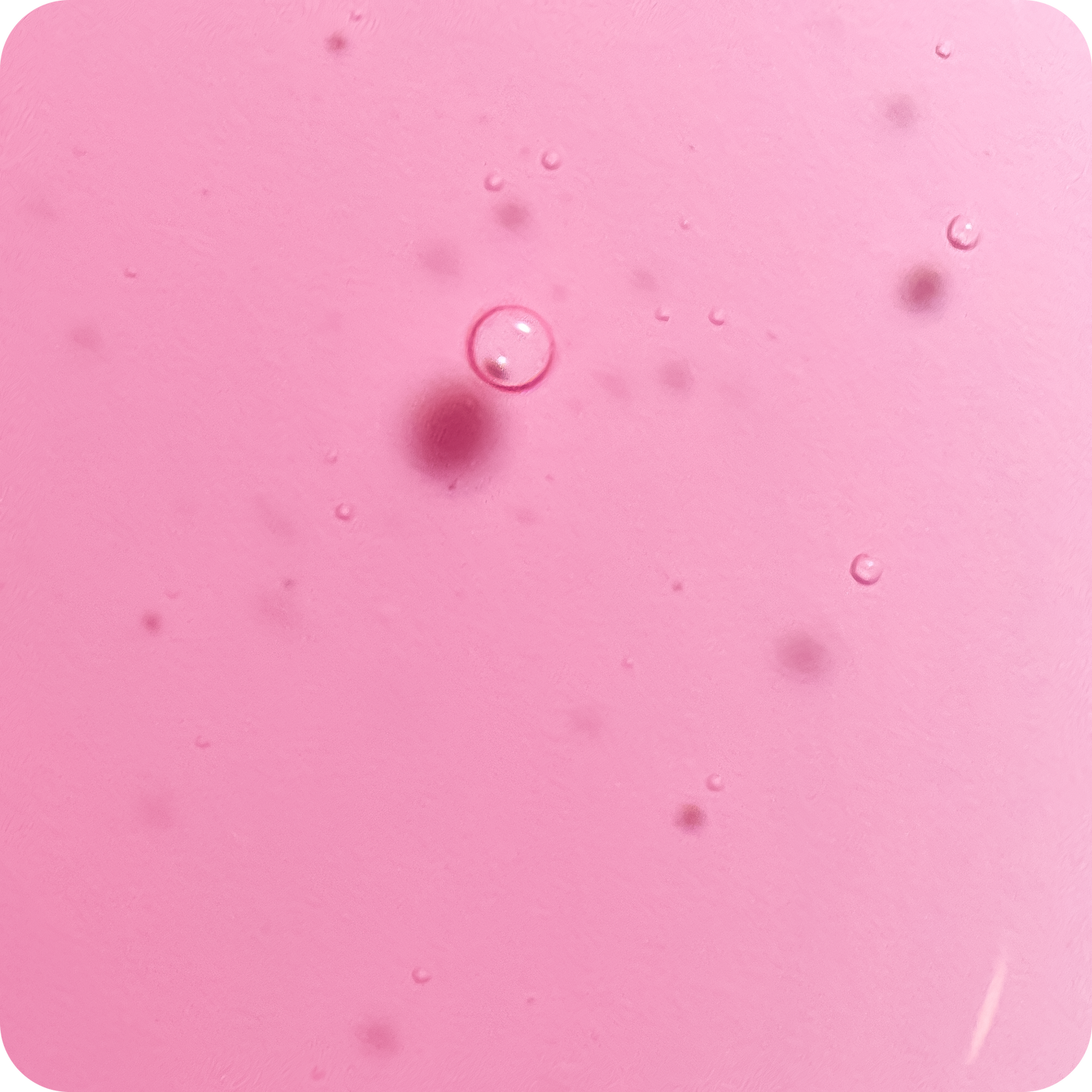 Pink textured background with small bubbles