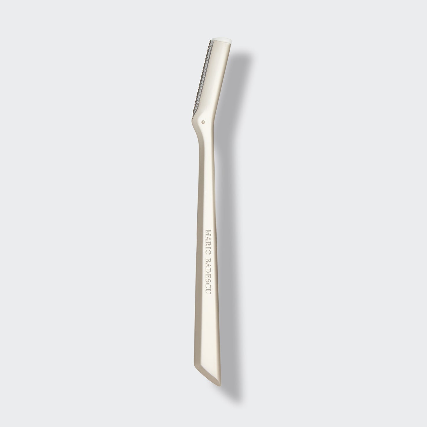 Metal Dermaplaner with brand name on a white background