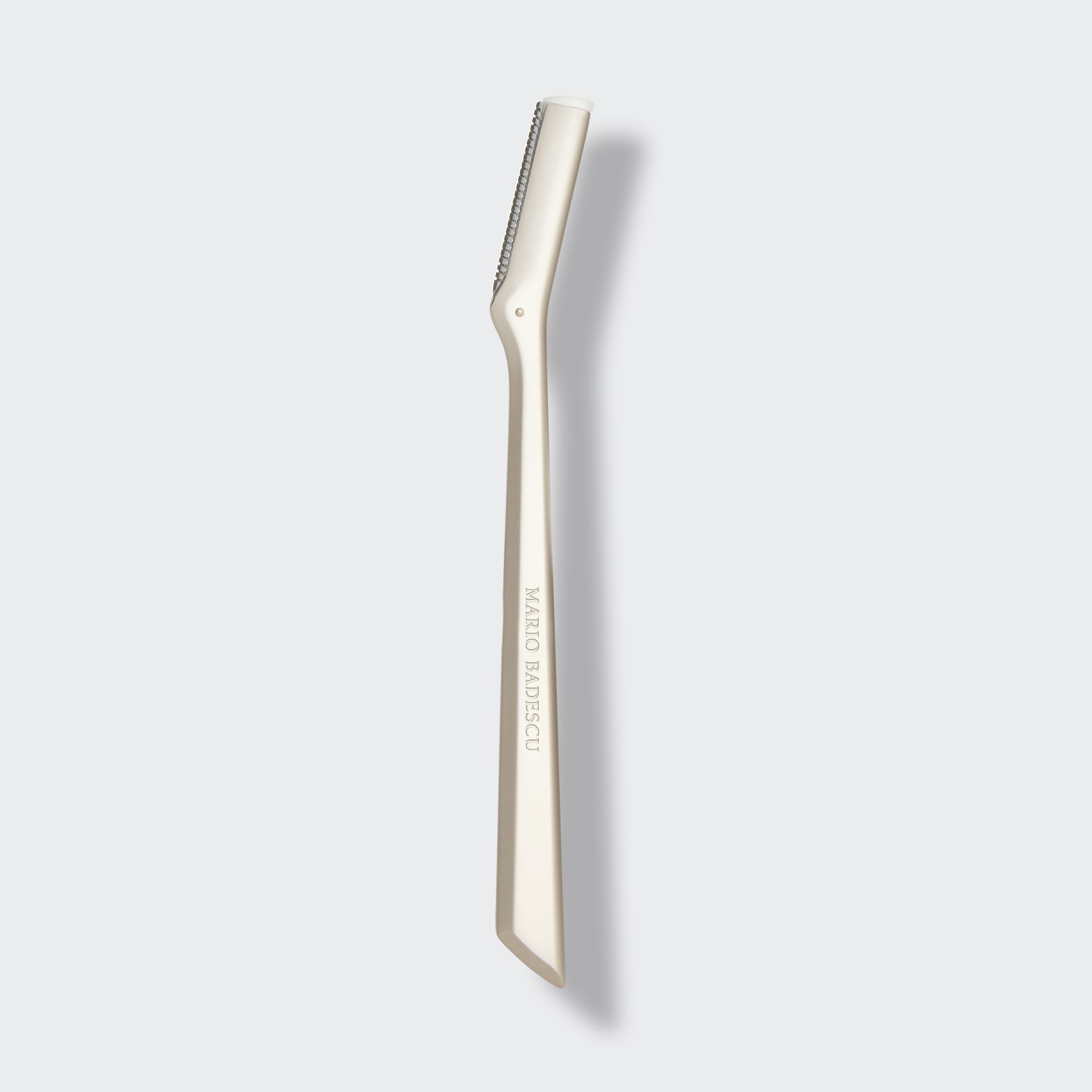 Metal Dermaplaner with brand name on a white background