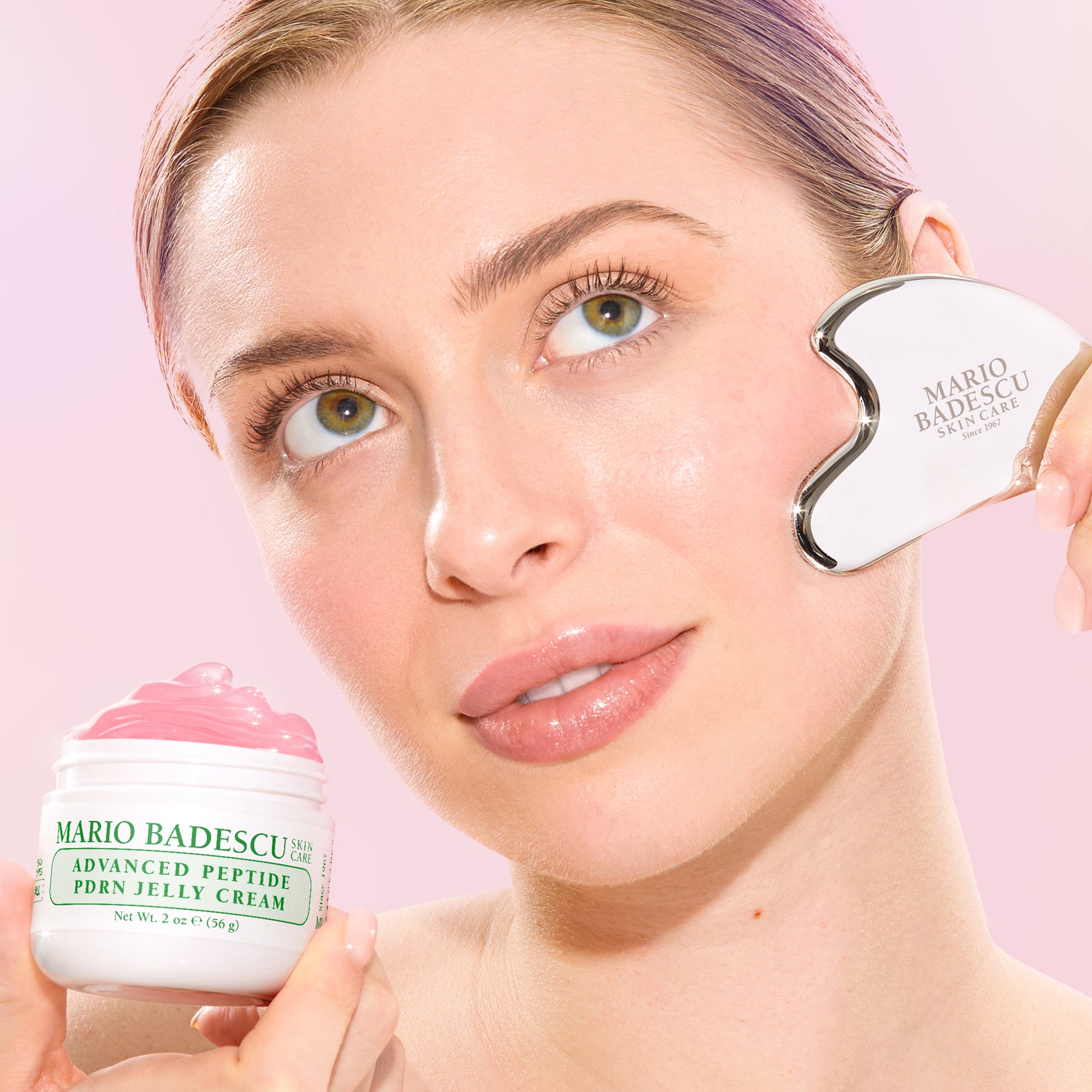 Woman applying Mario Badescu cream with a applicator on a pink background