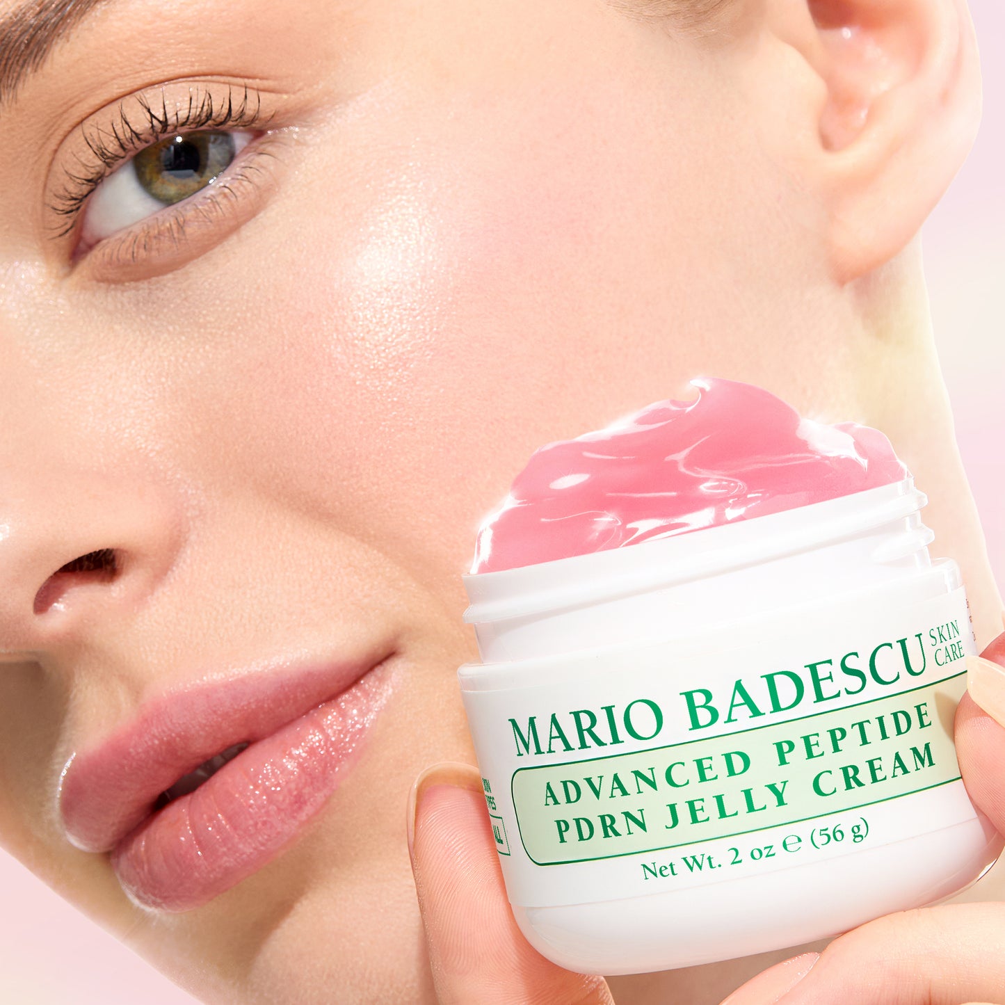 Person applying Mario Badescu Advanced Peptide PDNR Jelly Cream to their face.