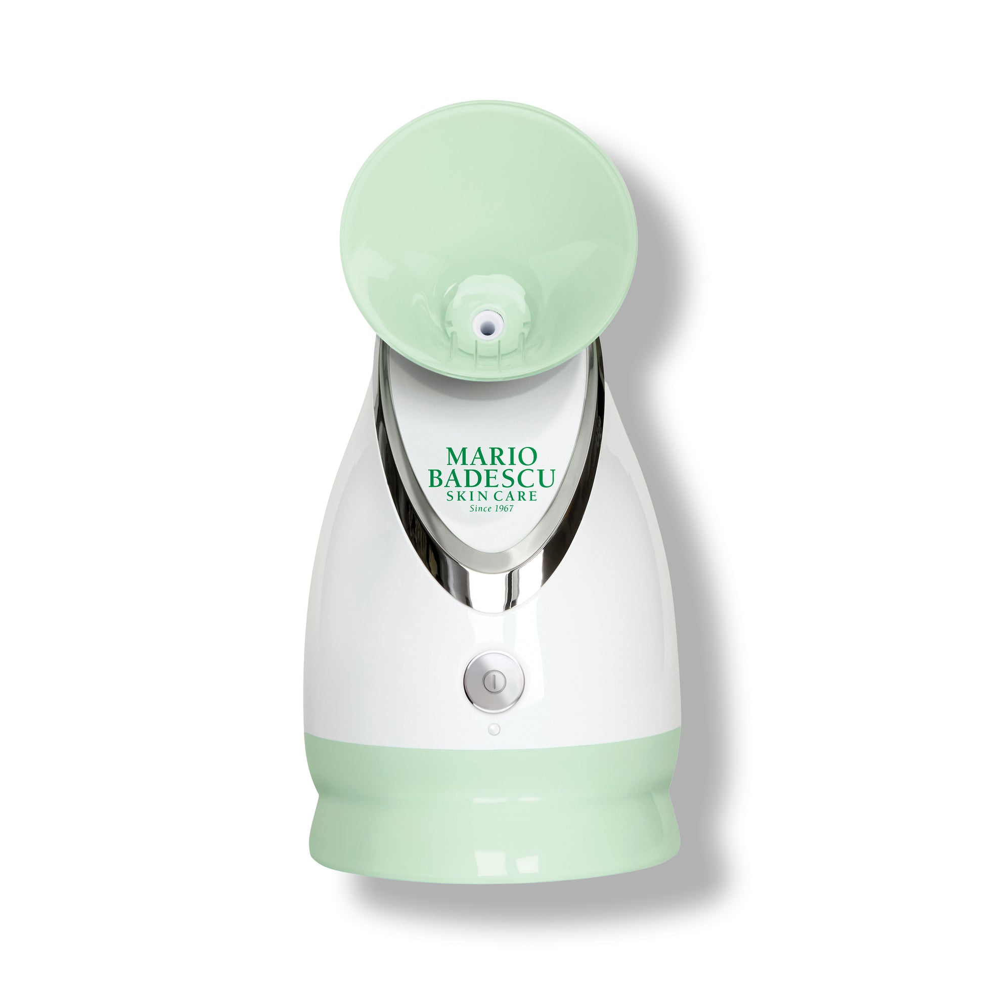 Green and white facial steamer with 'Mario Badescu' branding on a white background