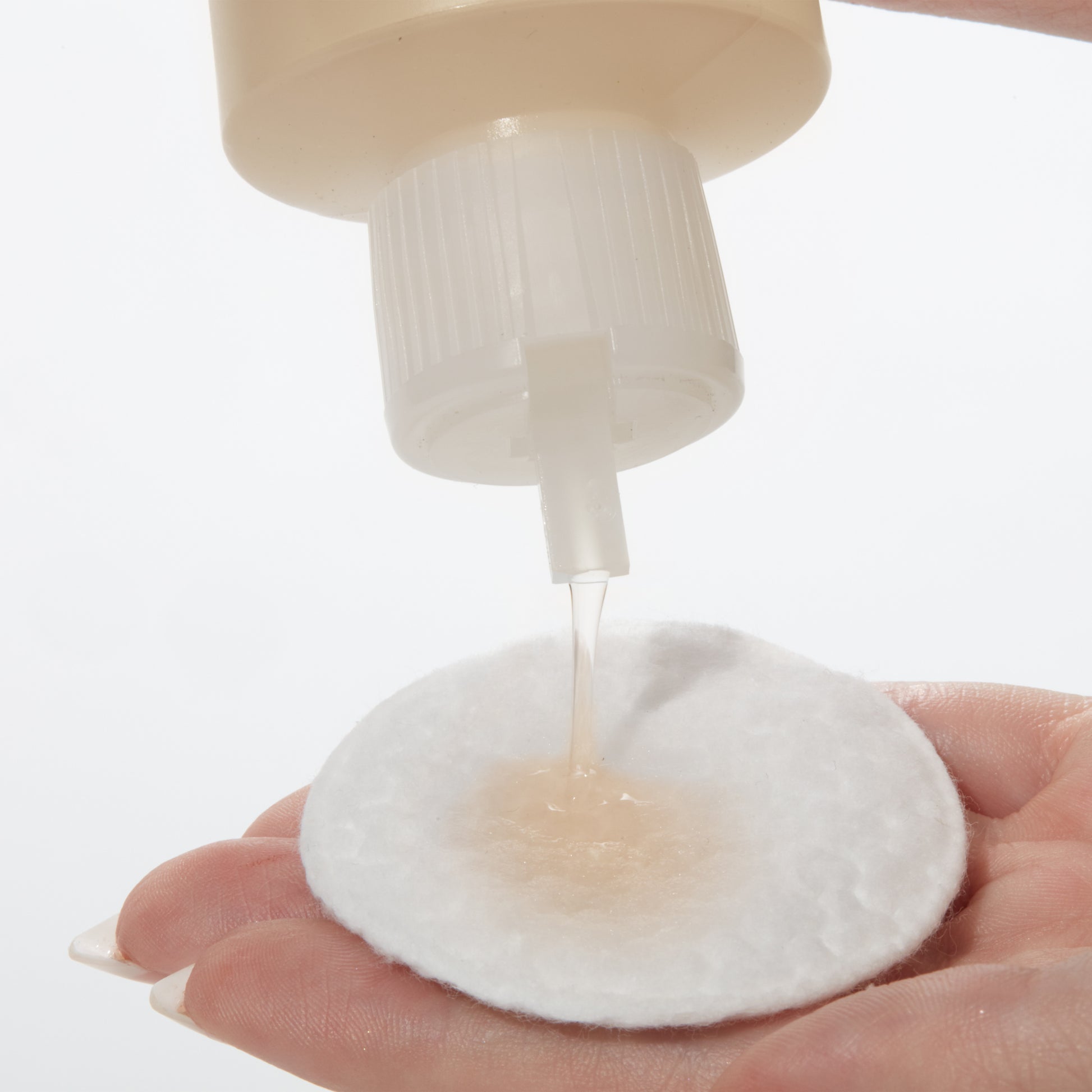 Demonstration showing how to use Chamomile Cleansing Lotion on a cotton pad