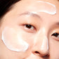 Woman demonstrating where to apply Protein Night Cream