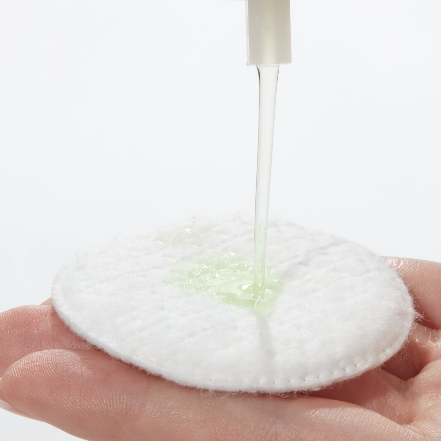 Demonstration showing how to use Aloe Vera Toning Lotion on a cotton pad