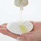 Demonstration showing Special C Toning Lotion on a cotton pad 