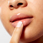 Woman demonstrating how to apply Lip Mask with Acai and Vanilla on her lips