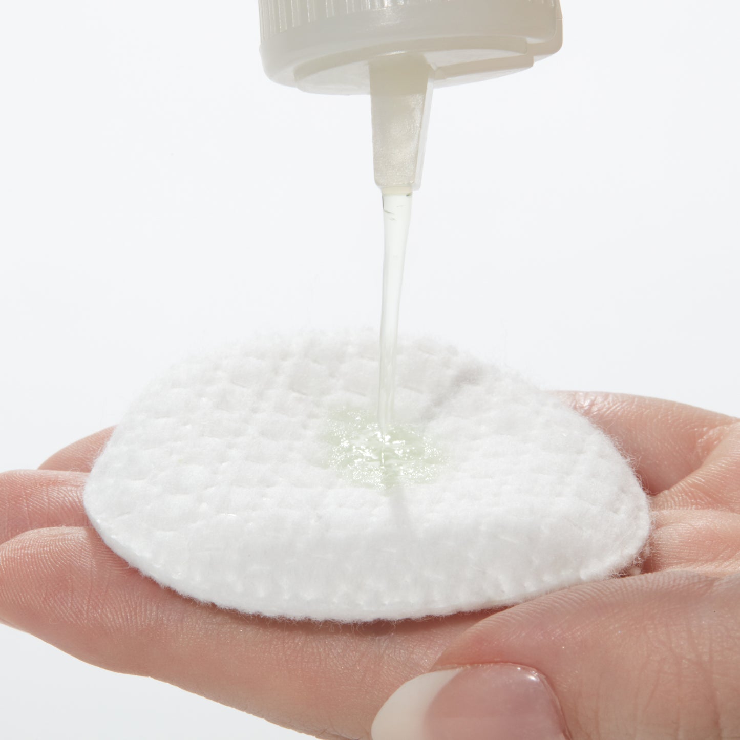 Demonstration showing how to use  Cucumber Cleansing Lotion on a cotton pad