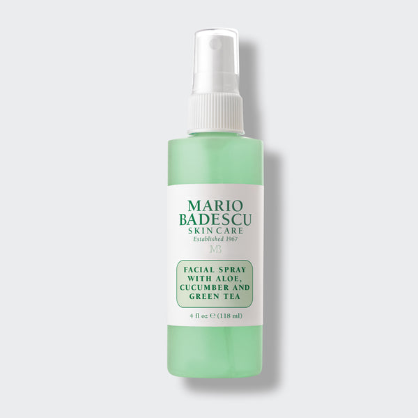 A green and white bottle of face spray